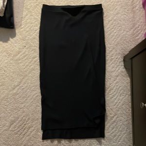 Ribbed knit pencil skirt. Hi-low hem. Hits at knee.